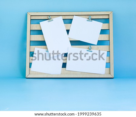 Frame on a light blue background with a place for signature on a white blanks. Blank template for placing your design.