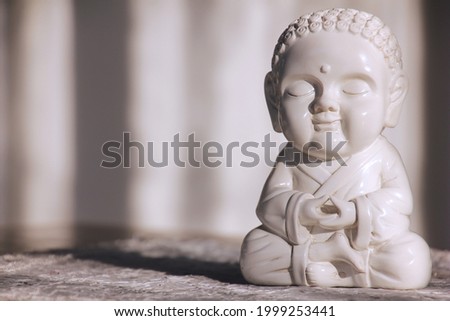 A cute little smiling Buddha.