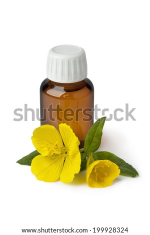 Bottle with  Evening Primrose oil and fresh flower isolated  on white background Royalty-Free Stock Photo #199928324