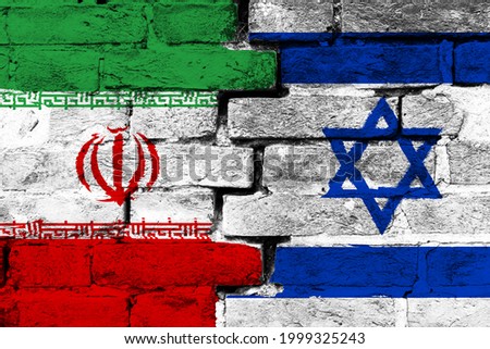 Concept of the relationship between Israel and Iran with two painted flags on a damaged brick wall
