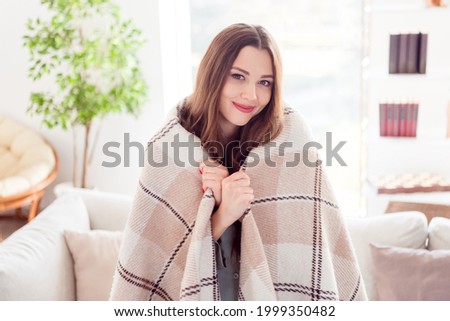 Photo of young attractive pretty girl happy positive smile cover herself blanket cozy rest relax warmth living-room indoors