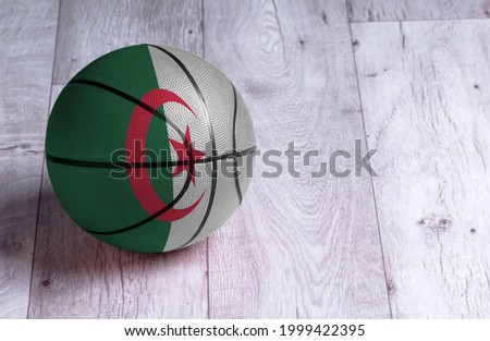 Algeria flag is featured on a basketball. Basketball championship concept.