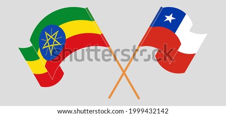 Crossed and waving flags of Ethiopia and Chile