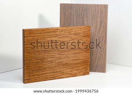 Natural wood texture for design and decor. Samples of wooden facades for kitchen cabinets.