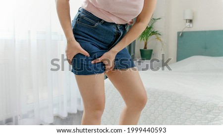 Close up shot of a wonderful girl in a denim up skirt