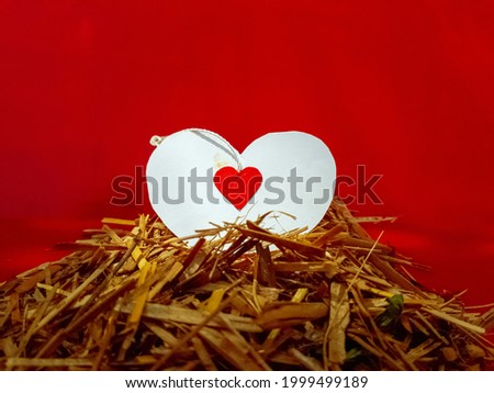 Picture of paper heart on hay , easy home decor ideas