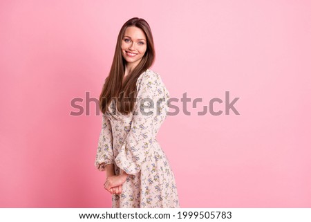 Photo portrait beautiful girl in printed dress smiling in spring isolated pastel pink color background Royalty-Free Stock Photo #1999505783