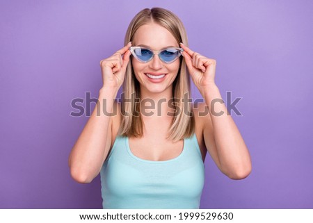 Photo portrait smiling blonde woman wearing sunglass happy nice isolated pastel violet color background