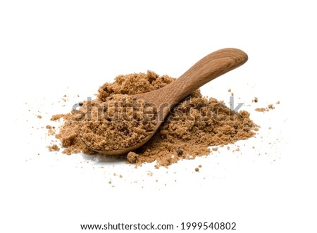 Brown cane sugar with wooden spoon isolated on white background 