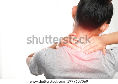 Women's neck and shoulder pain and injuries,muscle aches,health care and medical Royalty-Free Stock Photo #1999607069