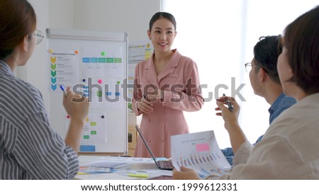 Group asia young people sale team staff or female leader work share plan idea talk in reskill upskill training class workshop seminar room. Happy workplace for data analysis project service solution. Royalty-Free Stock Photo #1999612331