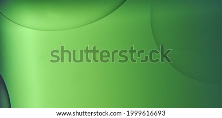 Monochrome green shapes of bubbles of oil in water