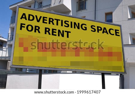 Advertising billboard with inscriptions Advertising space for rent against the background of a residential building