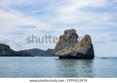 rock mountain in the middle of the sea