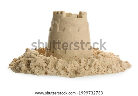 Pile of sand with castle on white background. Outdoor play Royalty-Free Stock Photo #1999732733