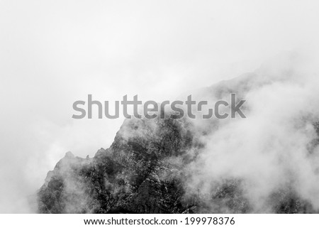 Landscape from Bucegi Mountains, part of Southern Carpathians in Romania in a very foggy day 