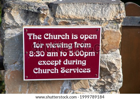 Sign at a church saying when viewing and service times are