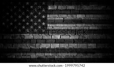 Flag of USA in grey scale on grunge brick wall