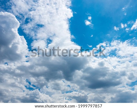 Sky clouds against the blue sky. Delicate natural background. White cumulus clouds