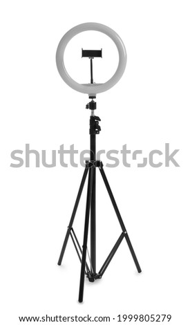 Modern tripod with ring light isolated on white