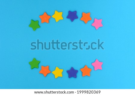 Sugar stars on colorful background. Decorations for cake.