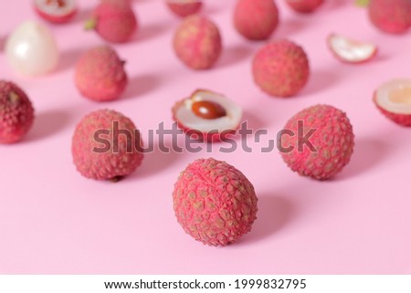 Fresh lychee with clipping path isolated on pink background.Colorful fruits pattern of lychees.
