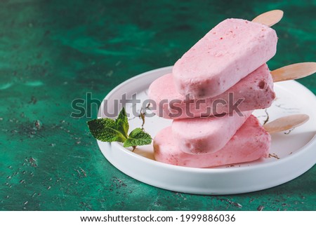 Plate with tasty strawberry ice cream on color background