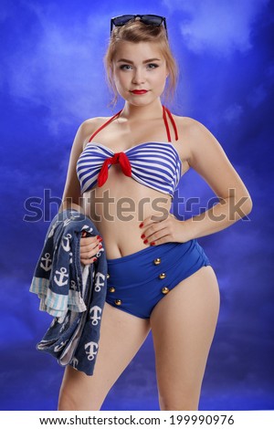 Pinup style young woman going to tan