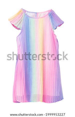 Summer dress isolated. Closeup of a beautiful pastel rainbow colored baby girl dress isolated on a white background. Children spring fashion. Macro.