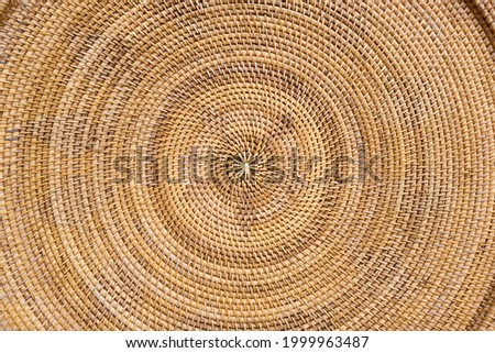 Round wicker woven pattern texture or background  Royalty-Free Stock Photo #1999963487