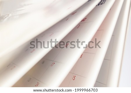 Abstract blur calendar page flipping sheet close up background business schedule planning appointment meeting concept