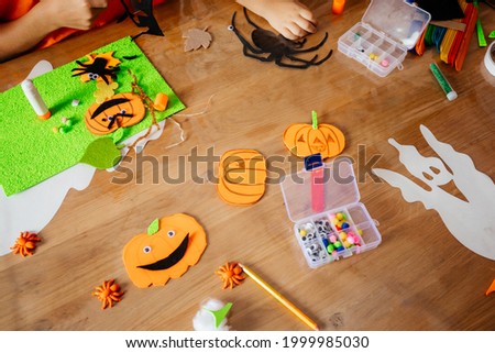 Funny Halloween pumpkins made of felt and paper, top view