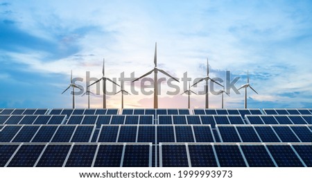 solar cell plant and wind generators in urban area connected to smart grid.Energy supply,eolic turbine,distribution of energy,Powerplant,energy transmission, high voltage supply concept. Royalty-Free Stock Photo #1999993973