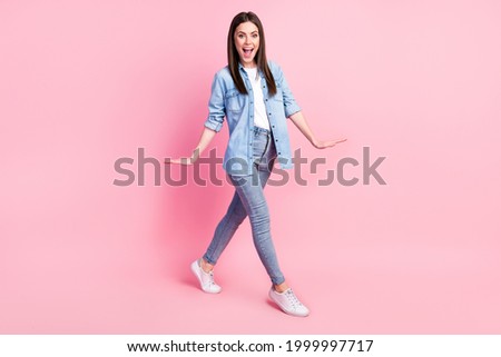 Full length body size view of attractive girlish funny cheerful girl having fun going isolated over pink pastel color background