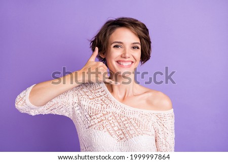 Photo of pretty positive person toothy smile hand finger show call me isolated on violet color background