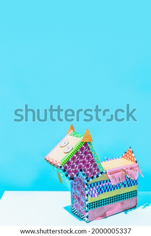 Cute Colorful Cartoon Alebrije Wolf-Dog Isolated on blue background. traditional Mexican symbols and elements