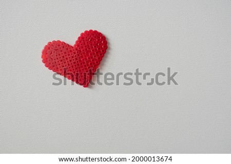 thermo mosaic ready-made figurines in the form heart red on white background