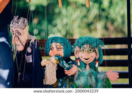 muster of puppets. street theater. marianette dolls Royalty-Free Stock Photo #2000043239