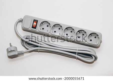 Carry extension cord with sockets. Wire for convenience in everyday life. Royalty-Free Stock Photo #2000055671