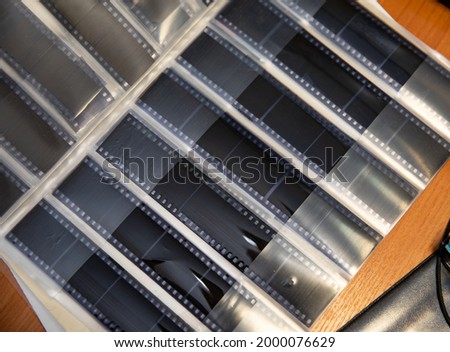 Storage of photographic films in special albums and containers.