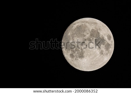 Full moon closeup on a night sky background. real life photo with no renders