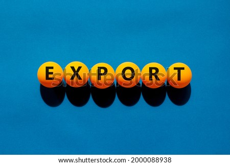 Export and business symbol. The concept word 'export' on orange table tennis balls on a beautiful blue background. Business and export concept.