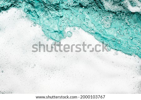 Blue sea water white foam texture background closeup, foamy ocean wave pattern, aqua bubbles surface, swimming pool backdrop, abstract summer sunny beach wallpaper, decorative frame border, copy space