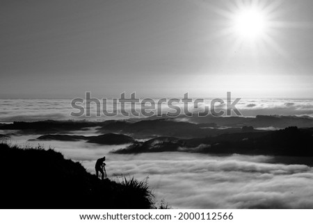 Landscape Photographer taking pictures of sunrise and morning fog atTe Mata Peak, Hawke's Bay, New Zealand