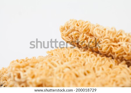 A block of dried Instant noodles on gray background paper