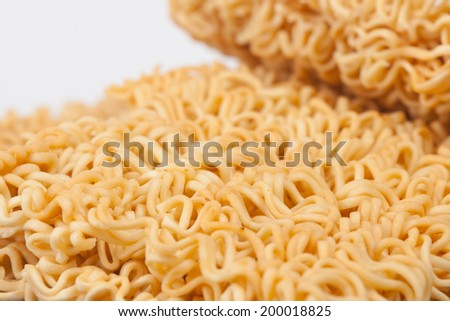 A block of dried Instant noodles on gray background paper