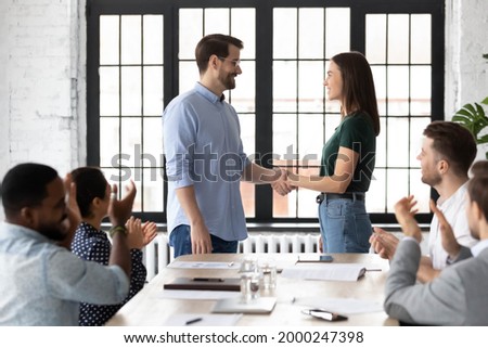 Welcome to team. Company leader shaking hands with intern or new employee, congratulating with getting job. Boss expressing respect and recognition to best worker or sales manager for good result Royalty-Free Stock Photo #2000247398