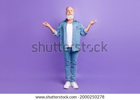 Full size photo of aged man happy positive smile meditate yoga zen om calm isolated over purple color background