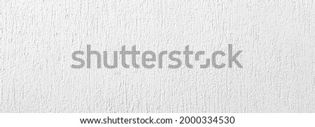 Panorama of Vintage white painted cement wall with rough surface texture and background seamless
