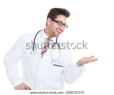 Portrait of young male doctor giving presentation over white background